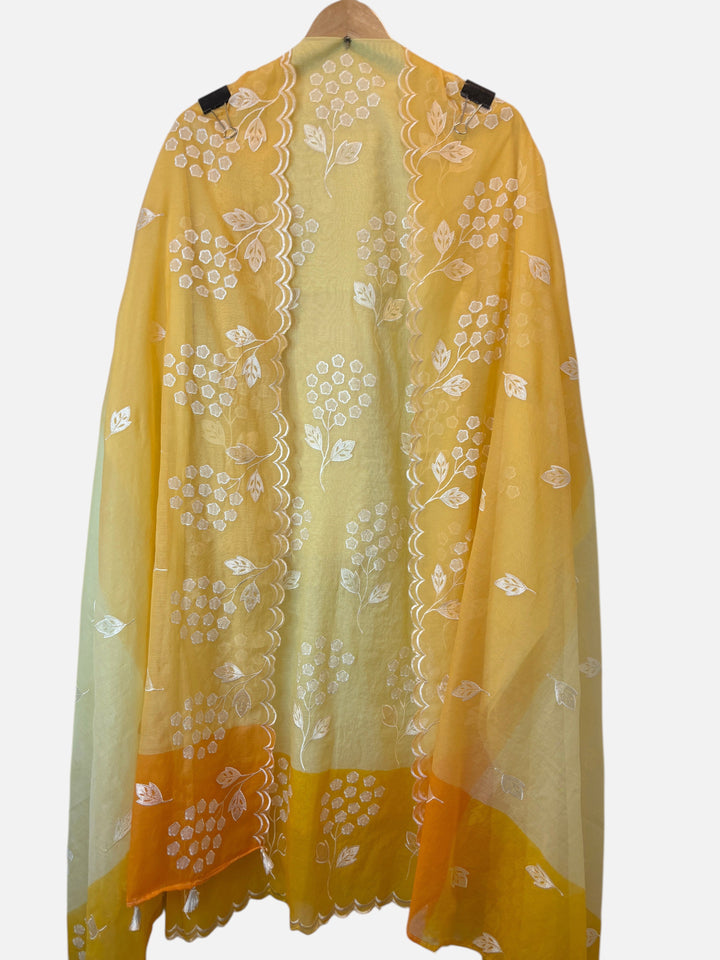 Design by Pakiza yellow ombre mul chanderi unstitched suit fabric with white floral applique work and scalloped edges