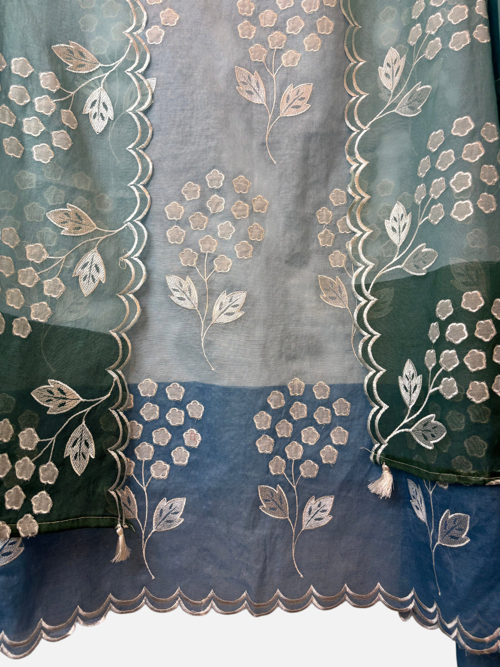 Design by Pakiza blue and green ombre mul chanderi fabric with intricate white floral applique and scalloped edges