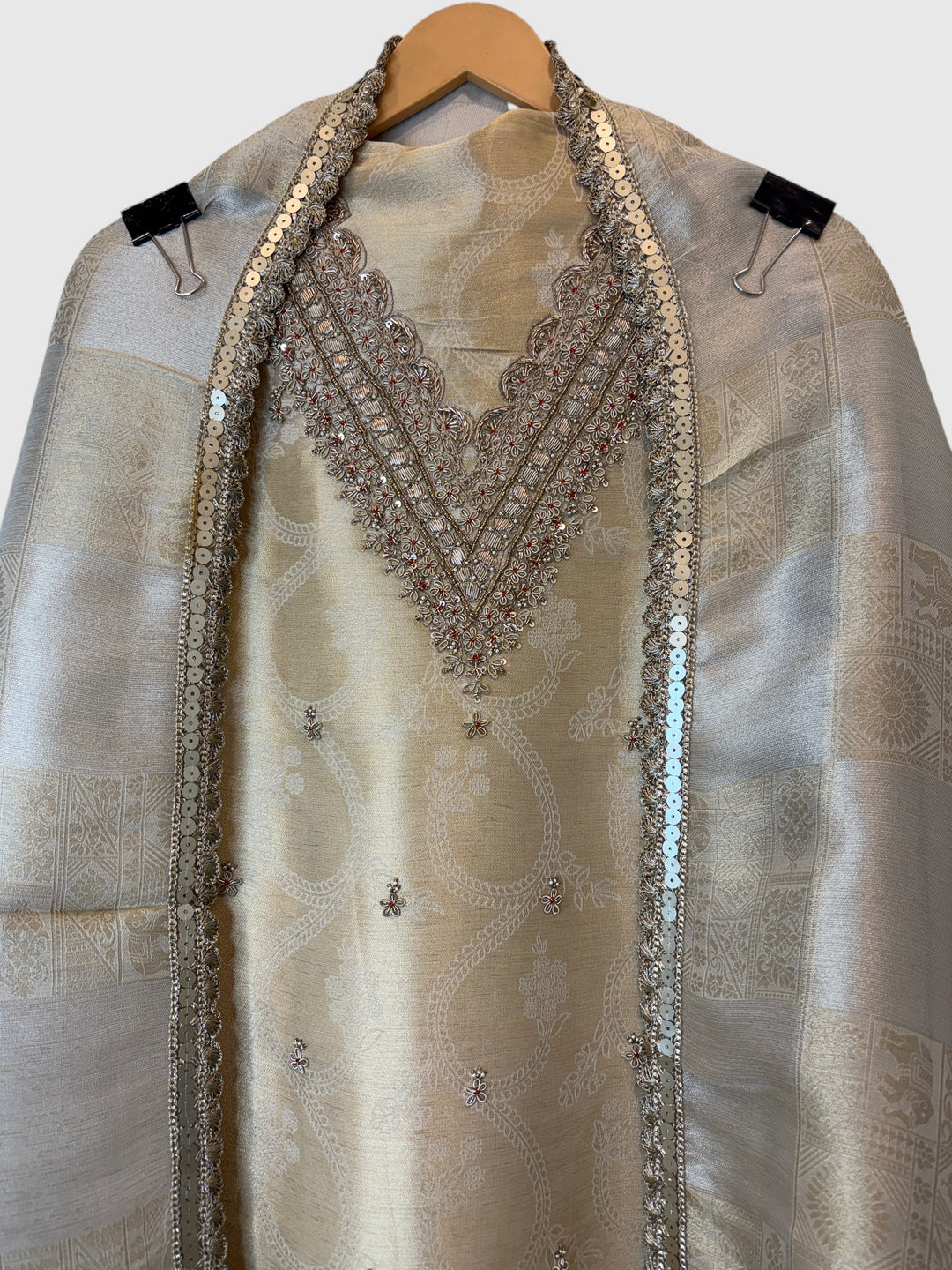 Design by Pakiza ivory gold pure tissue 3-piece suit with intricate dabka, sequin, and beadwork on the neckline.