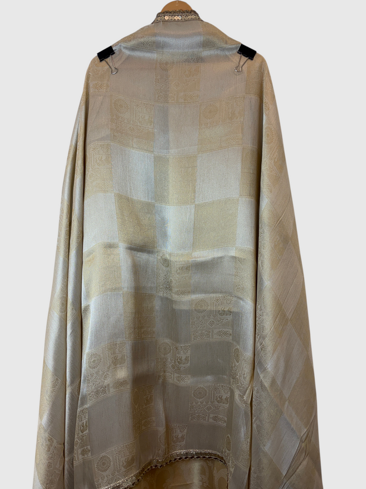 Design by Pakiza ivory gold pure tissue fabric with self-woven patterns and intricate beaded border detailing