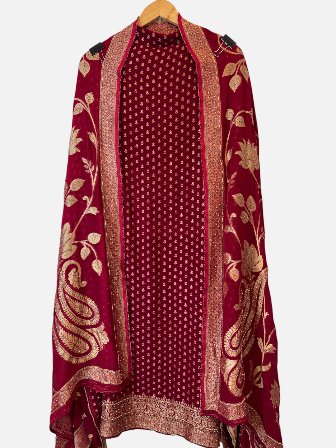 Design by Pakiza maroon red khadi georgette Banarasi suit set with gold woven booties and intricate beadwork details.