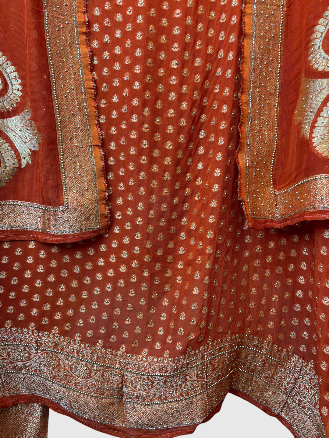 Design by Pakiza orange pure khadi georgette Banarasi suit with intricate gold woven booties and beaded embellishments