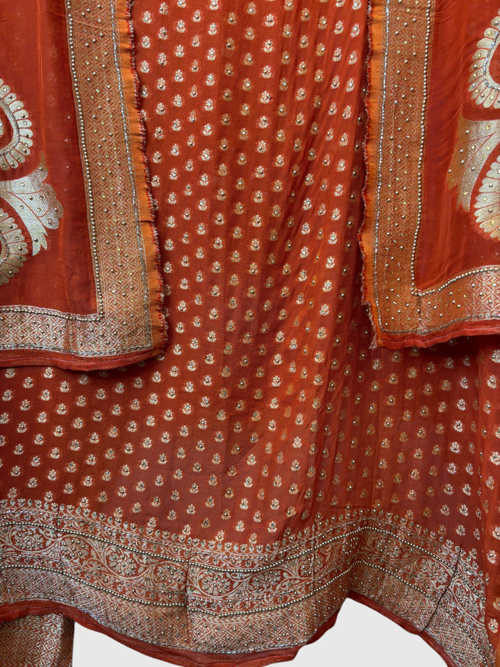Design by Pakiza orange pure khadi georgette Banarasi suit with intricate gold woven booties and beaded embellishments