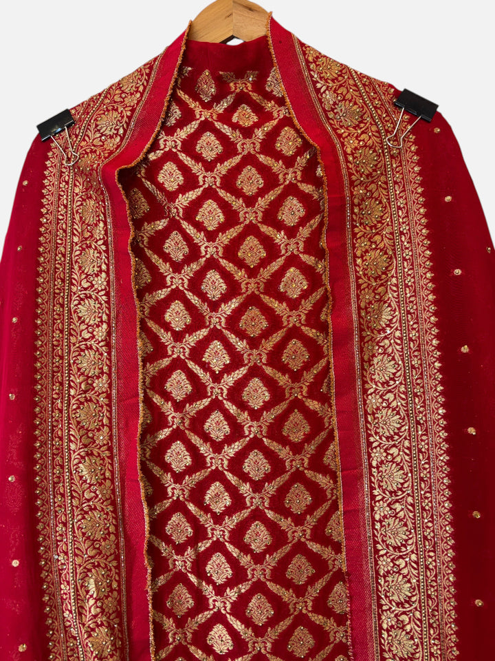 Design by Pakiza red Khadi Georgette unstitched shirt with intricate gold Banarasi jaal and stone embellishments.