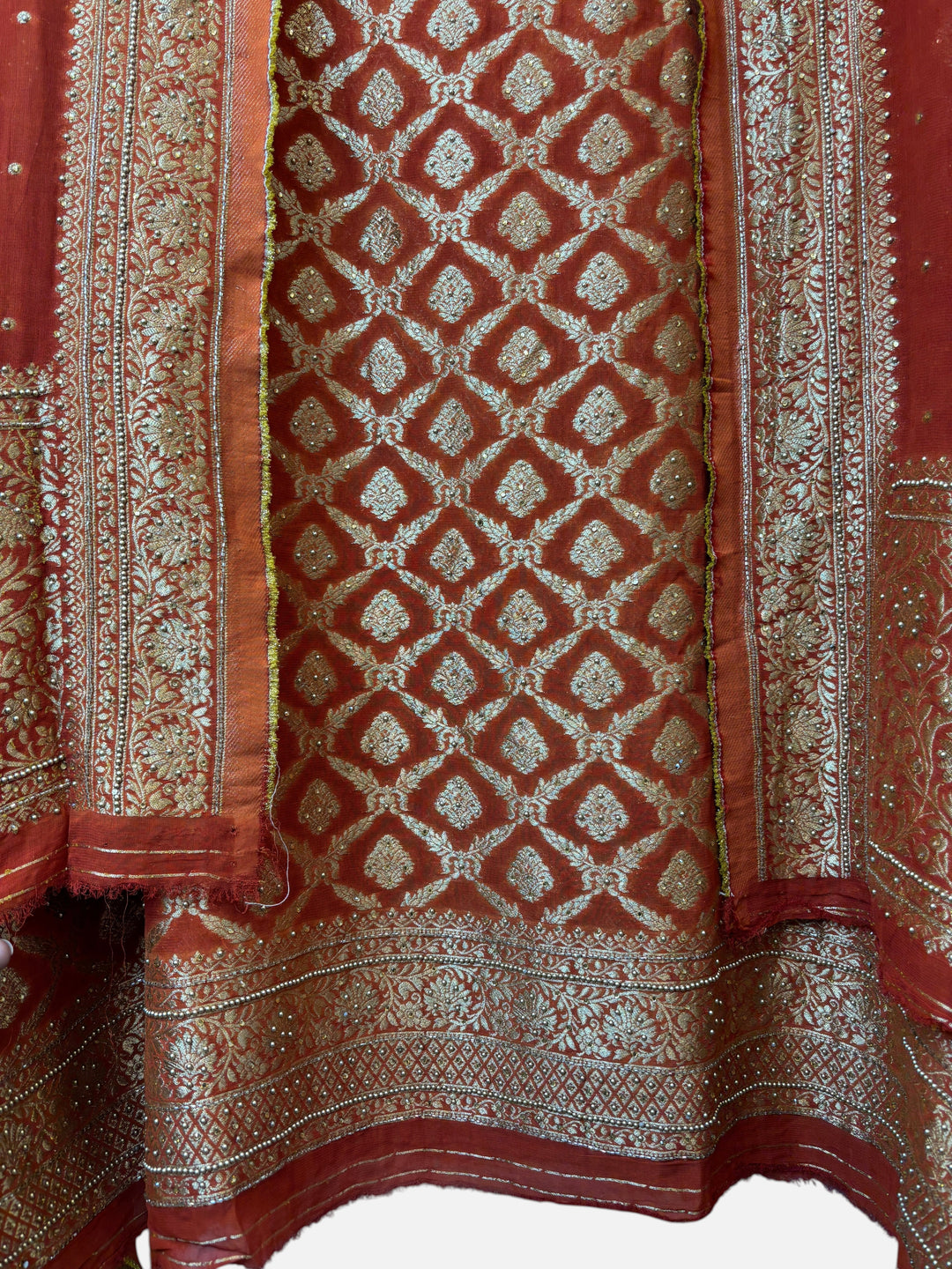 Design by Pakiza rust Khadi Georgette shirt with gold Banarasi jaal, stone embellishments, and matching dupatta