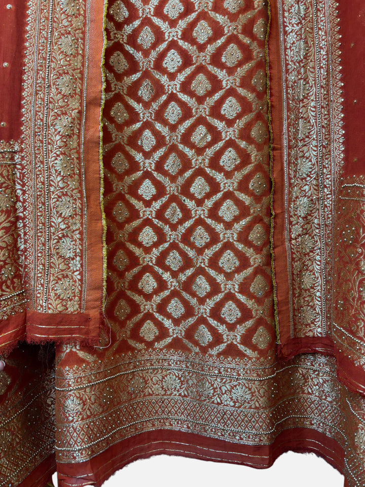 Design by Pakiza rust Khadi Georgette shirt with gold Banarasi jaal, stone embellishments, and matching dupatta