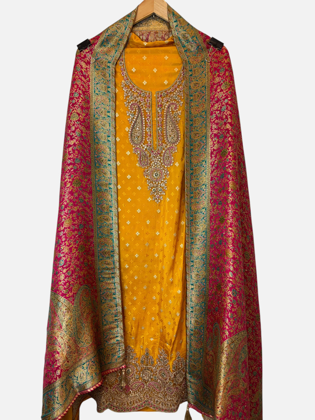 Design by Pakiza yellow Banarasi silk unstitched 3-piece suit with intricate zari, sequin, and stone embellishments.