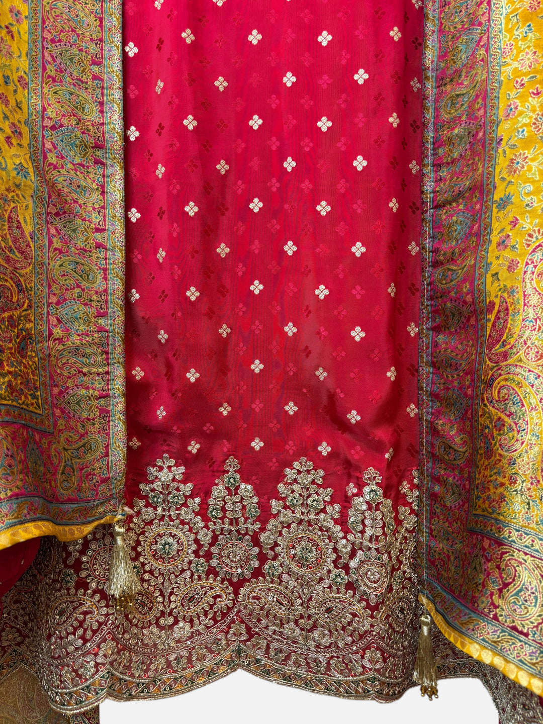 Design by Pakiza red Banarasi silk ensemble with intricate zari, sequin, and stone embellishments and woven dupatta