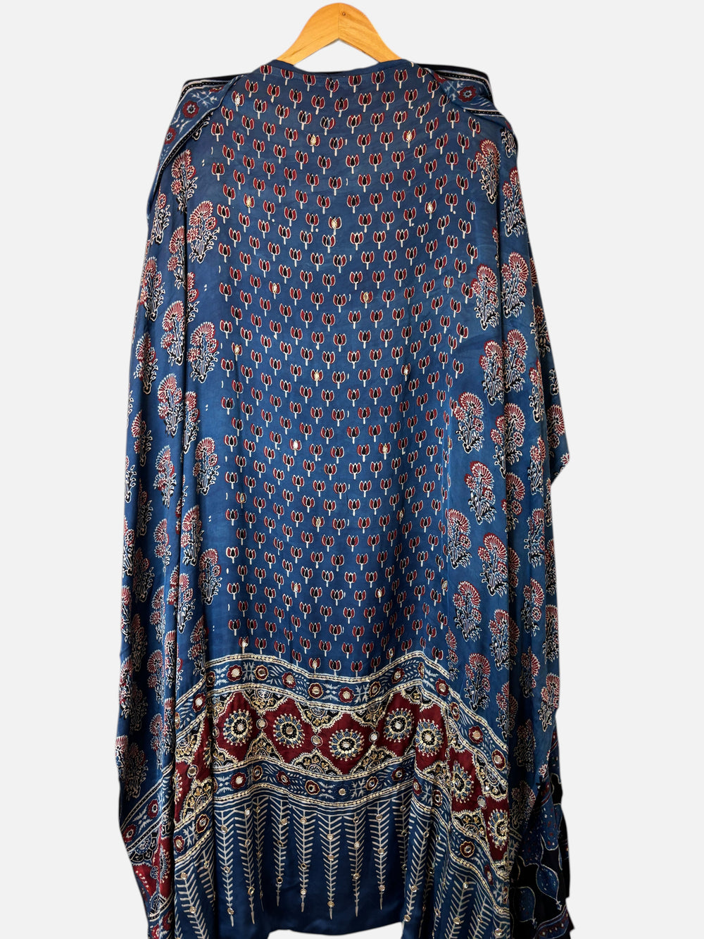 Design by Pakiza blue modal suit set featuring traditional Ajrakh lotus print, mirror work, and tassel detailing.
