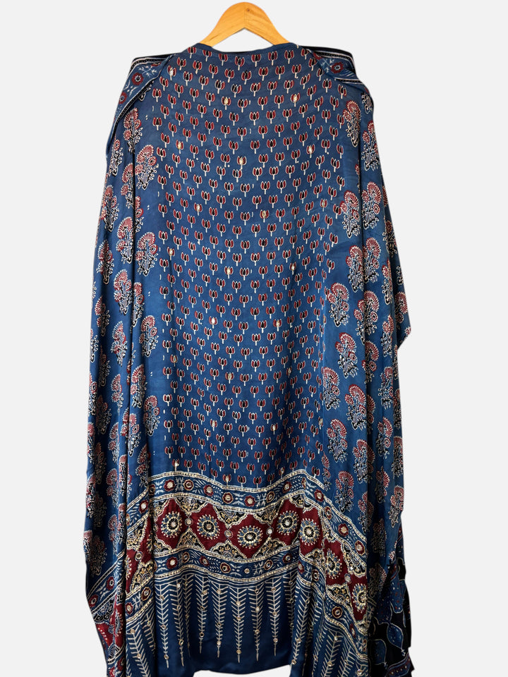 Design by Pakiza blue modal suit set featuring traditional Ajrakh lotus print, mirror work, and tassel detailing.