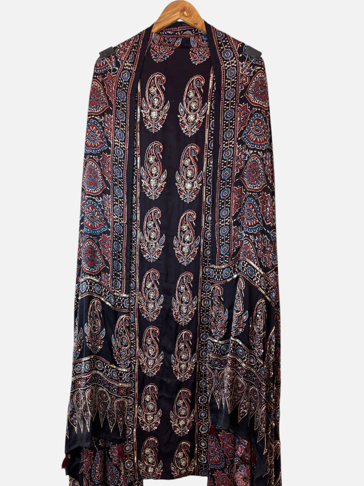 Design by Pakiza black modal silk ensemble with traditional Ajrakh hand block print, paisley motifs, and zardozi work.
