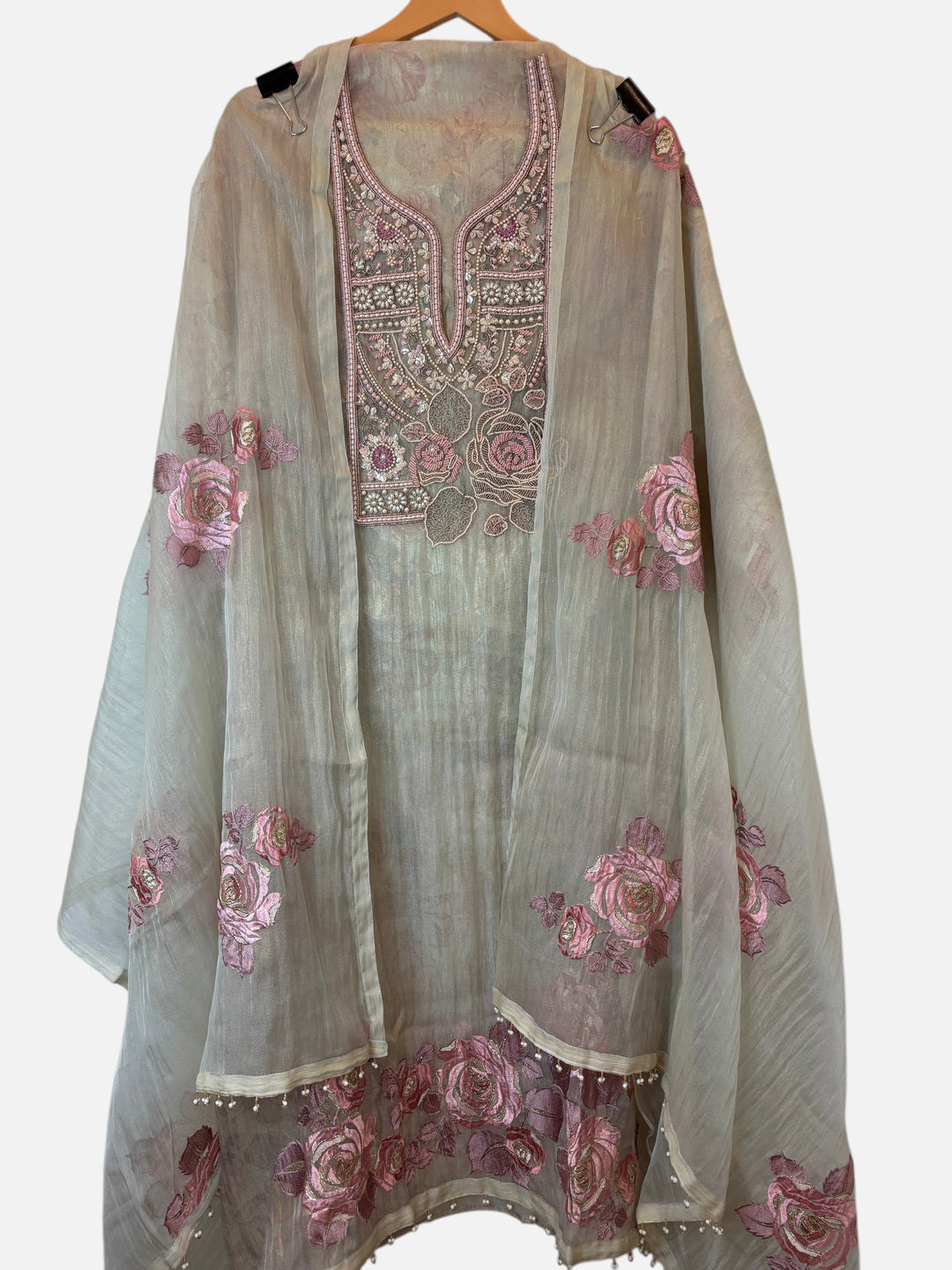 Design by Pakiza crush tissue 3-piece ensemble with pearl, bead, and zari floral embroidery on a beige fabric.