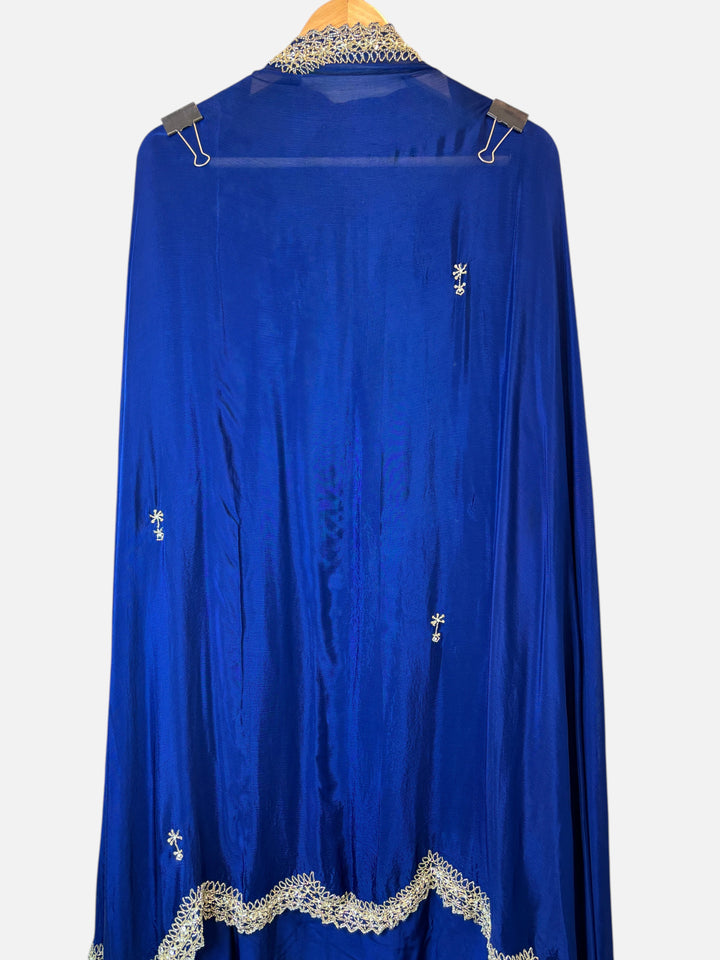 Design by Pakiza royal blue crepe fabric with intricate cutdana, sequin, and pearl embellishments and cutwork border.