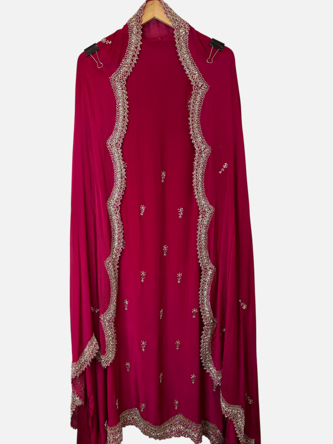 Design by Pakiza deep pink pure crepe unstitched suit with intricate cutdana, sequin, and pearl embellishments.