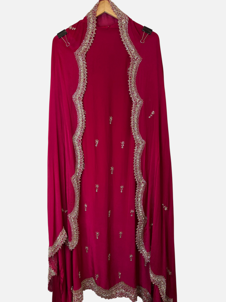 Design by Pakiza deep pink pure crepe unstitched suit with intricate cutdana, sequin, and pearl embellishments.