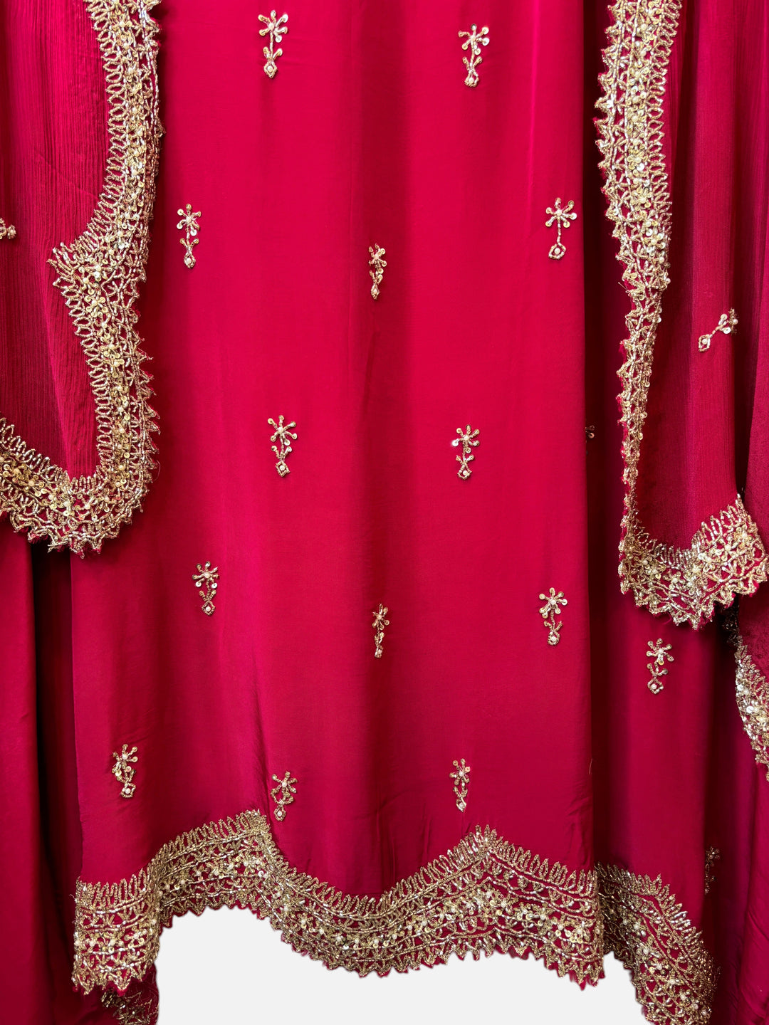 Design by Pakiza deep pink pure crepe fabric with intricate gold cutdana, sequin, and pearl embroidery details.