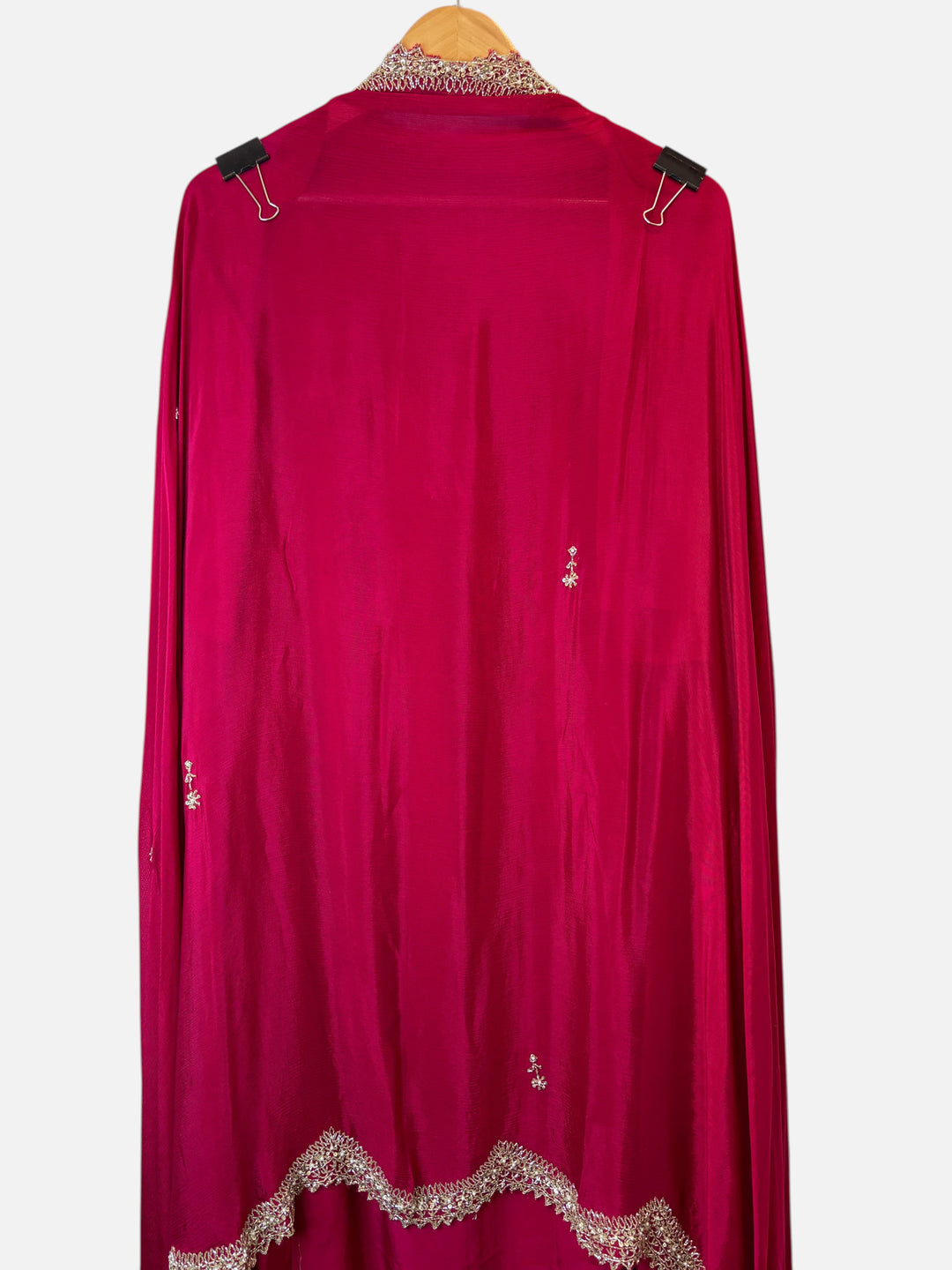 Design by Pakiza magenta pure crepe unstitched shirt featuring intricate cutdana, sequin, and pearl embellishments.