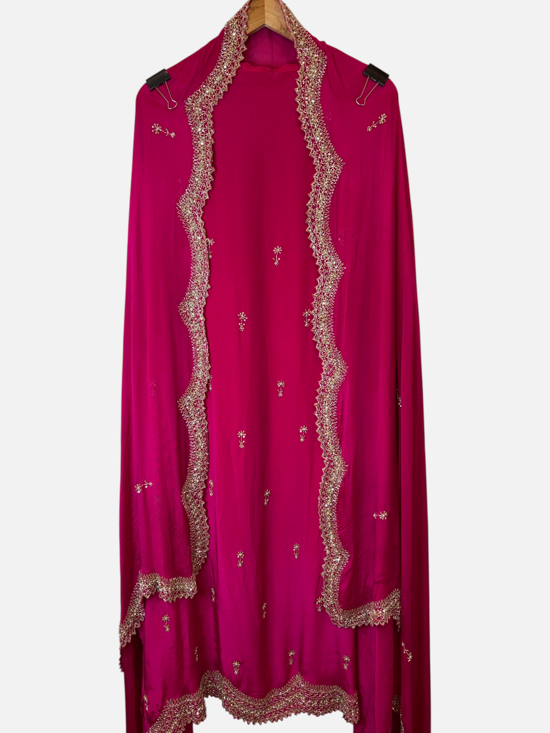 Design by Pakiza fuchsia pink crepe dupatta with intricate gold cutwork borders, sequins, and pearl embellishments.