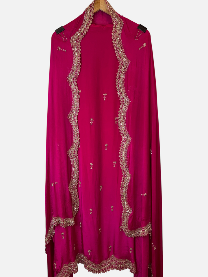Design by Pakiza fuchsia pink crepe dupatta with intricate gold cutwork borders, sequins, and pearl embellishments.