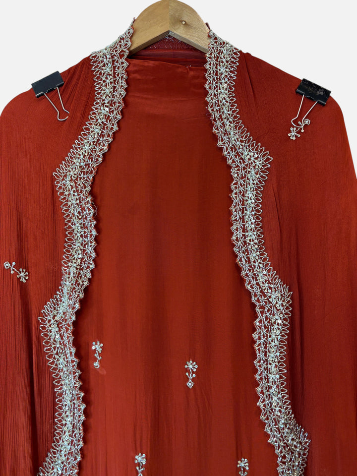 Design by Pakiza rust red pure crepe shirt with intricate silver cutdana, sequin, and pearl embroidery detailing