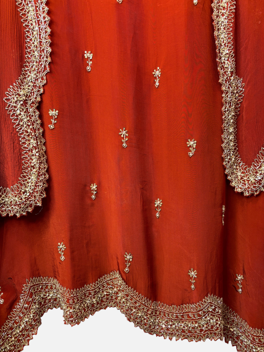 Design by Pakiza red pure crepe fabric with intricate gold cutdana, sequin, and pearl embroidery and cutwork border