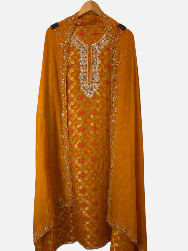 Design by Pakiza yellow khadi georgette Banarasi ensemble with embellished neckline and organza dupatta