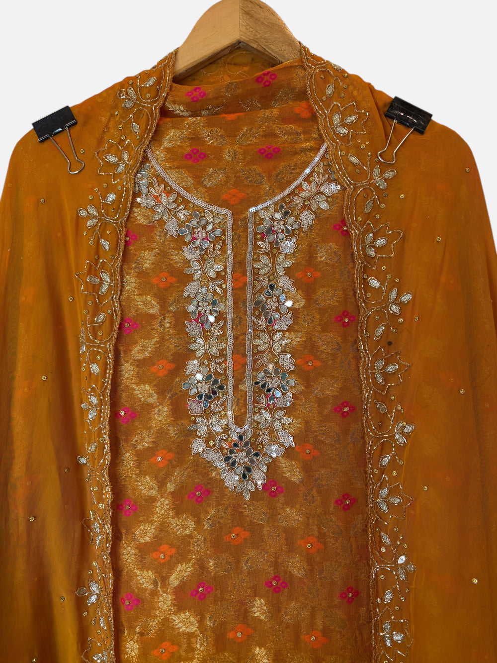 Design by Pakiza yellow khadi georgette Banarasi shirt with intricate mirror, dabka, and sequin embellished neckline.