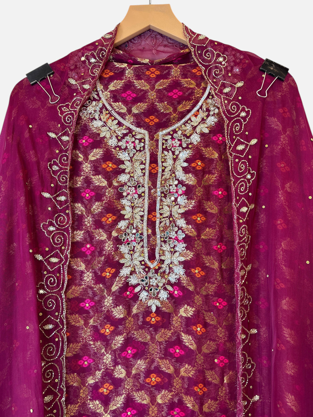 Design by Pakiza wine khadi georgette Banarasi shirt with intricate dabka, sequin, and mirror embellished neckline.
