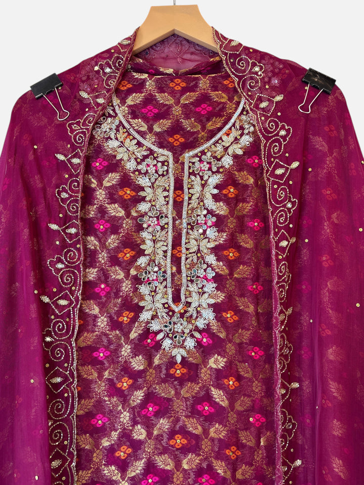 Design by Pakiza wine khadi georgette Banarasi shirt with intricate dabka, sequin, and mirror embellished neckline.