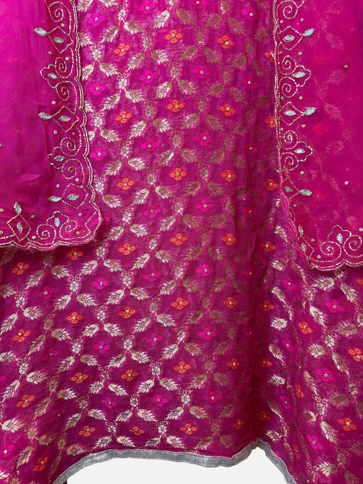 Design by Pakiza wine khadi georgette Banarasi fabric with intricate gold weaving, beadwork, and embellished borders