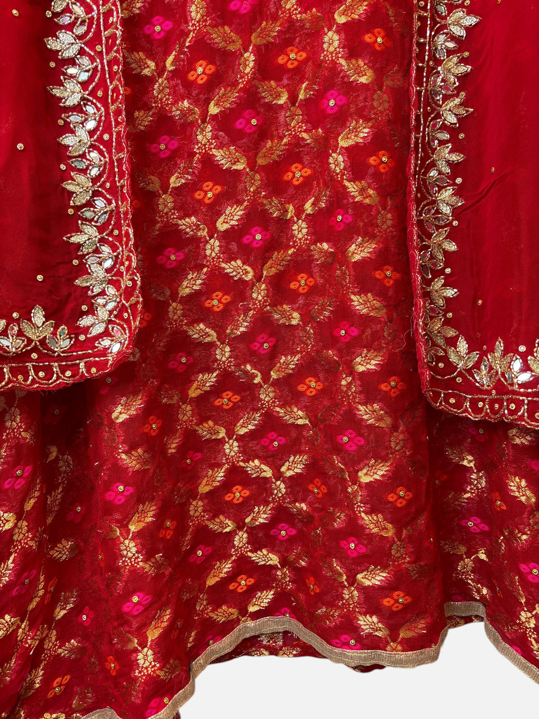 Design by Pakiza red khadi georgette Banarasi ensemble with intricate gold embroidery, sequins, and mirror work.