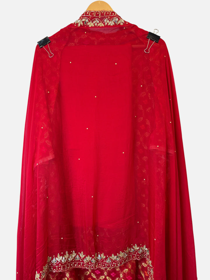 Design by Pakiza red khadi georgette Banarasi shirt with intricate dabka, sequin, and mirror embellished neckline.