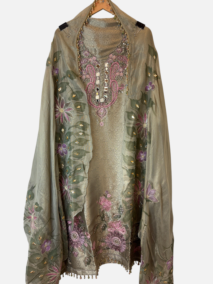 Design by Pakiza green tissue brocade 3-piece ensemble with hand-painted dupatta, mirror work, and beaded embroidery.
