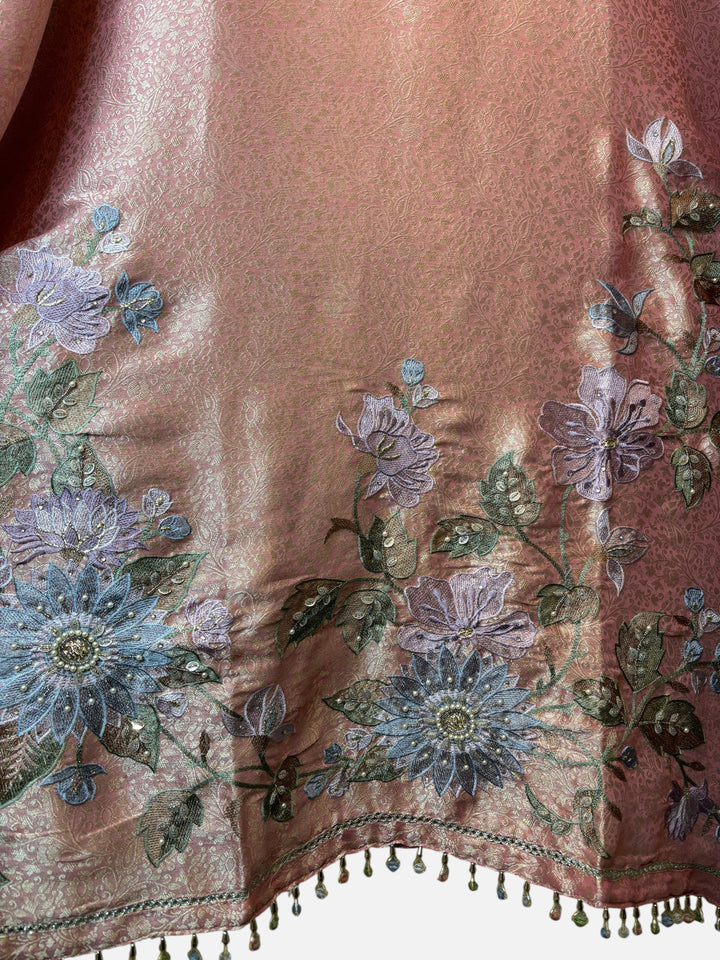 Design by Pakiza peach tissue brocade fabric with intricate floral embroidery, bead, pearl, and mirror detailing.