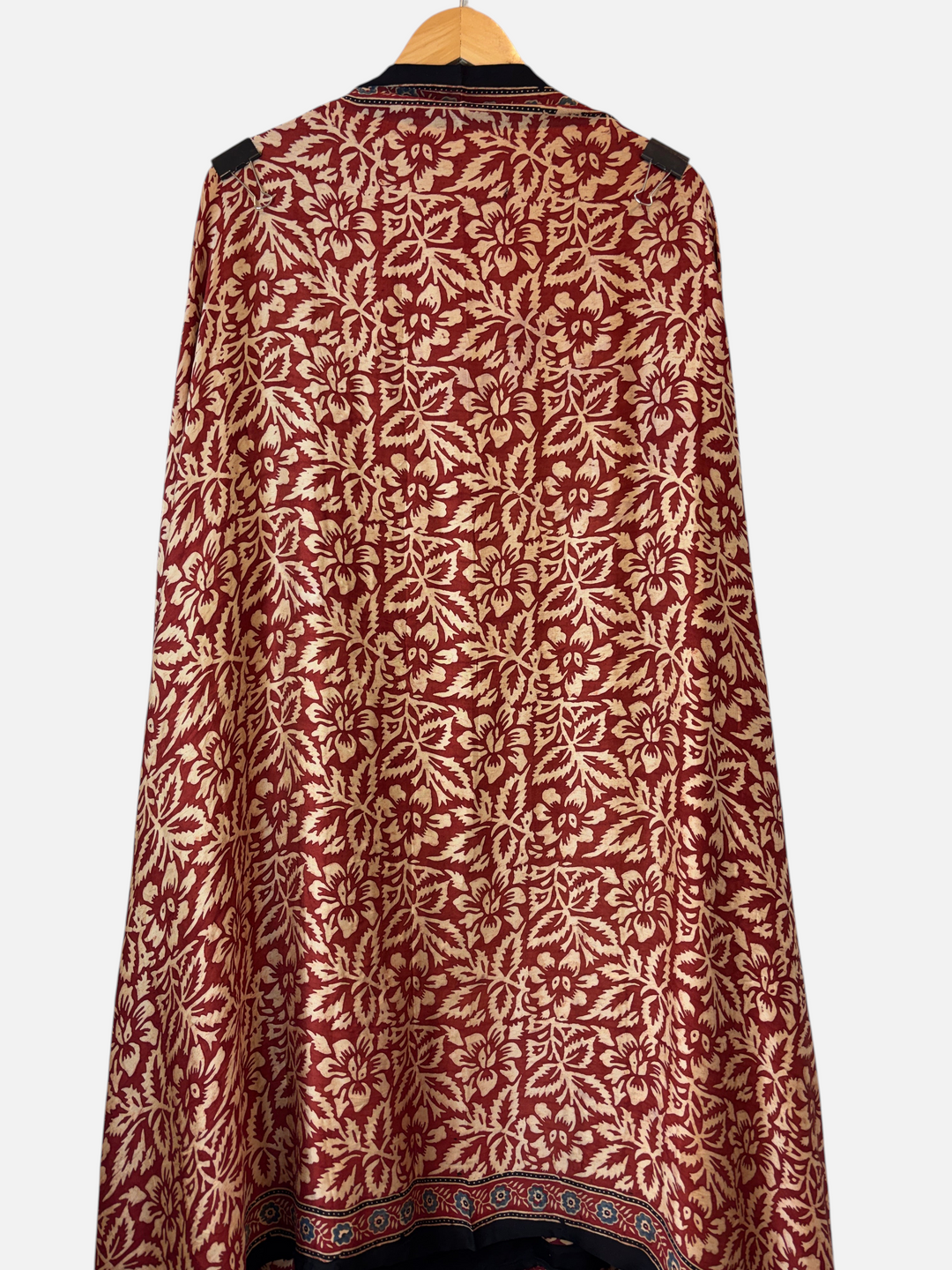Design by Pakiza Zehra modal silk fabric featuring a deep red and cream floral Ajrakh block print pattern