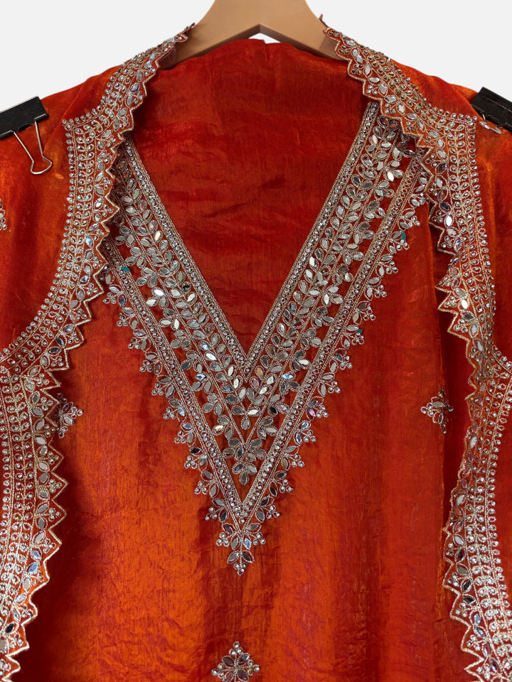 Design by Pakiza orange glass organza shirt featuring a V-neckline with intricate silver mirror and stone embroidery