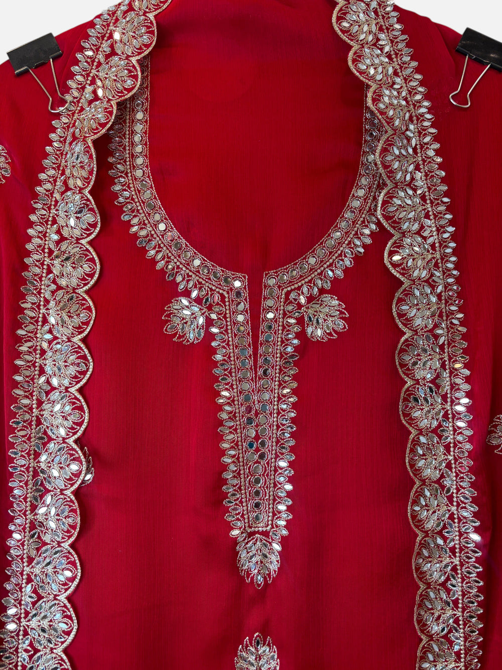 Design by Pakiza red chinon organza shirt with intricate gold zari work and mirror embellishments on the neckline