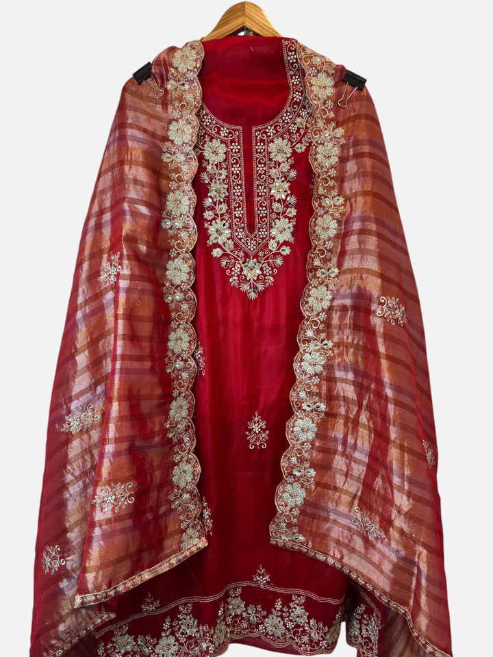 Design by Pakiza red glass organza 3-piece ensemble with intricate zari, pearl, and sequin embroidery and cutwork.