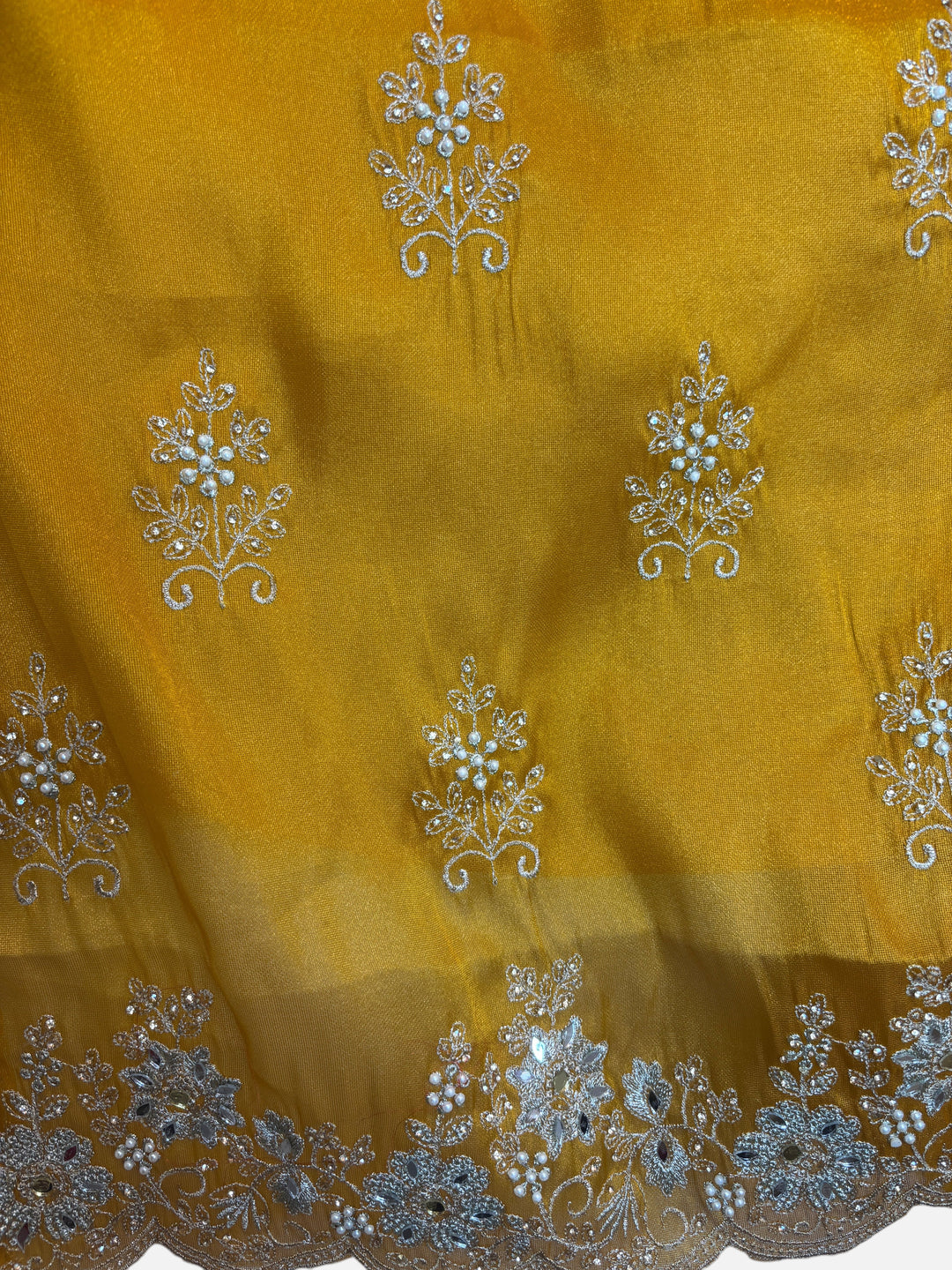 Design by Pakiza mustard glass organza fabric with intricate silver zari, pearl, and sequin floral embroidery