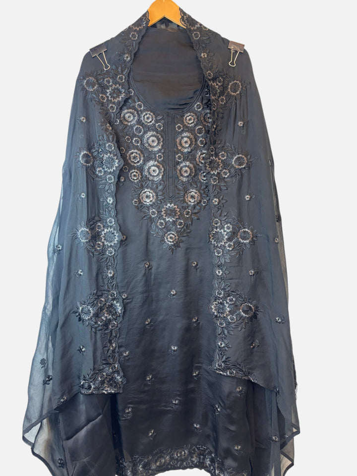 Design by Pakiza black satin organza shirt with intricate tone-on-tone Parsi embroidery on the neckline and front.