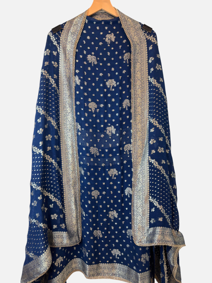 Design by Pakiza blue khadi georgette dupatta with intricate gold Banarasi woven patterns and elegant lace borders.