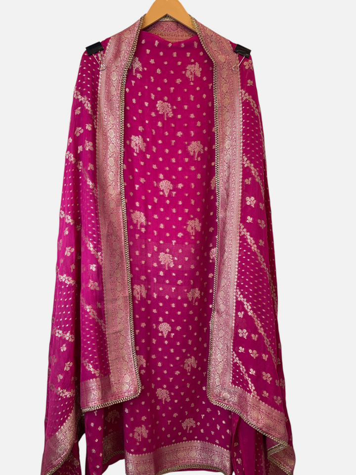 Design by Pakiza pink khadi georgette Banarasi woven ensemble with intricate gold patterns and delicate lace trim