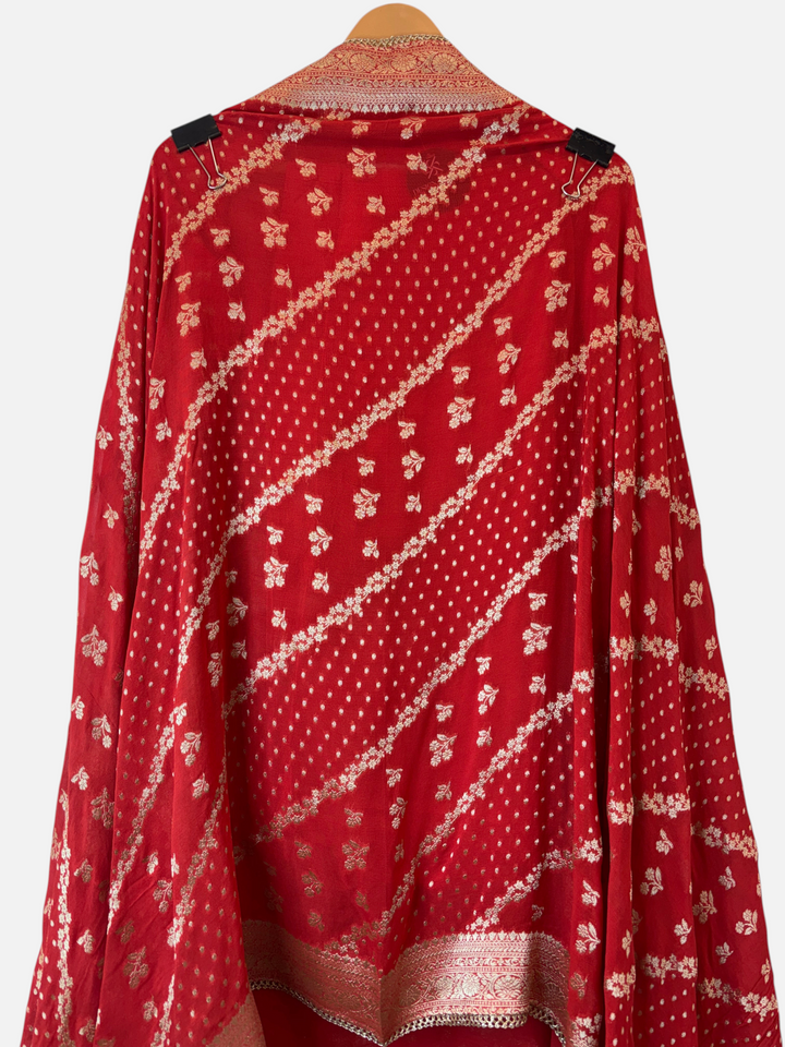 Design by Pakiza orange khadi georgette dupatta with intricate gold Banarasi woven patterns and elegant lace borders.