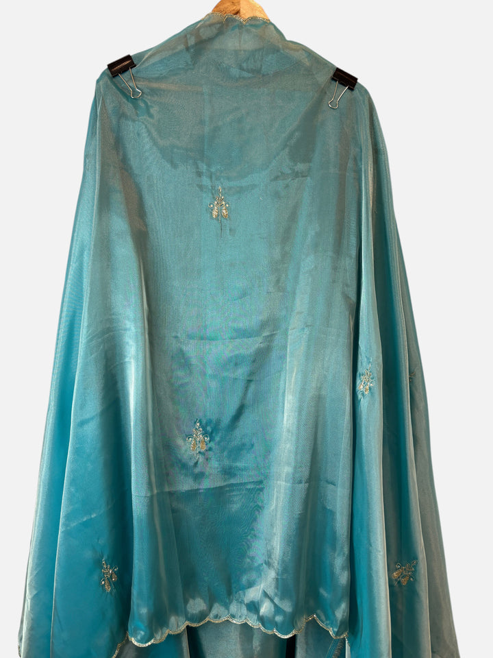 Design by Pakiza teal Kanjivaram dupatta with intricate zari and dabka handwork booties and scalloped cutwork edges