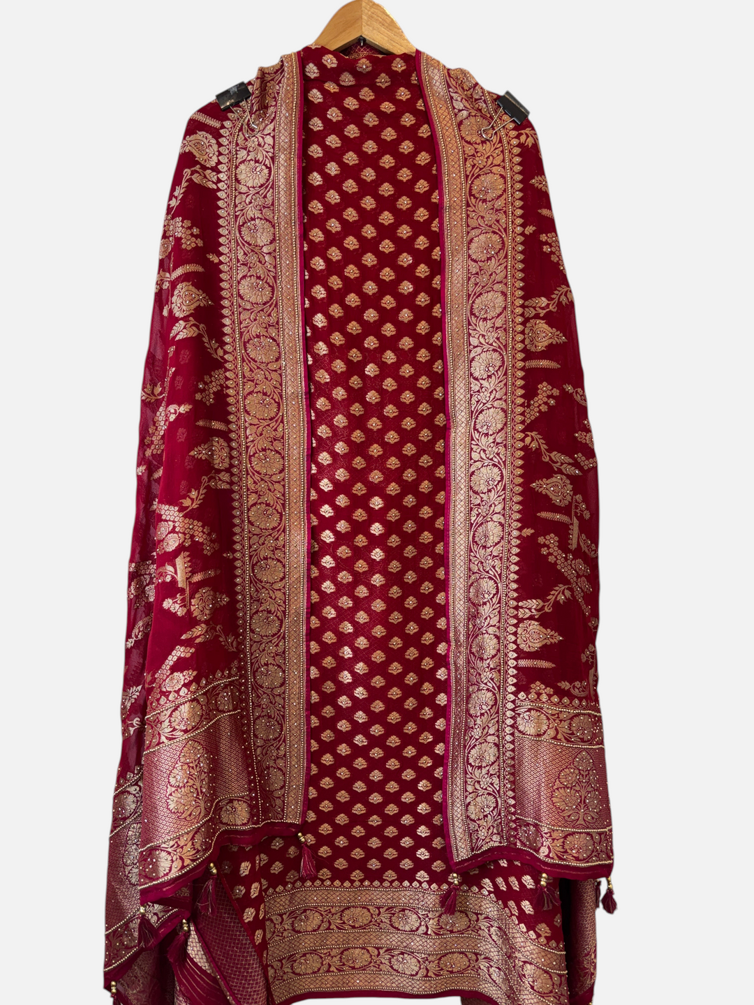 Design by Pakiza Meher red khadi georgette suit with intricate multi-gold jaal patterns and tassel embellishments