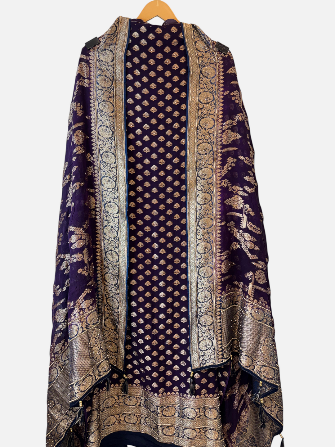 Design by Pakiza purple khadi georgette suit with intricate multi-gold jaal patterns and elegant tassel embellishments