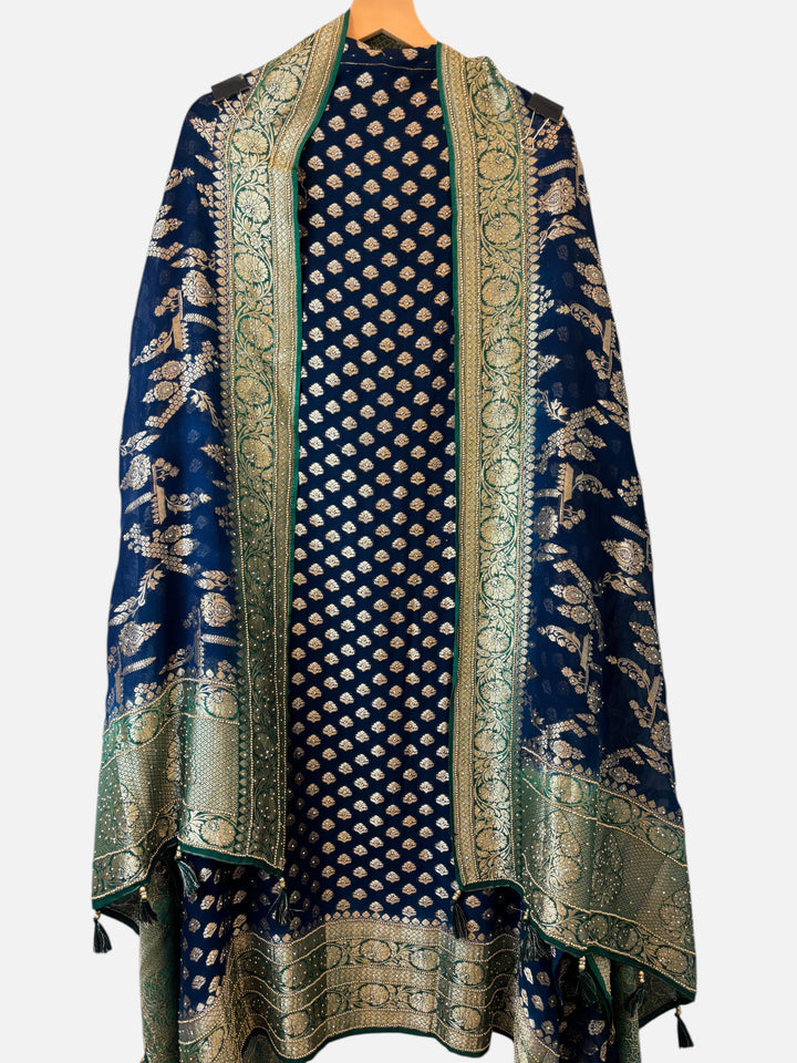 Design by Pakiza navy blue khadi georgette suit with intricate gold jaal pattern and traditional Banarasi weave