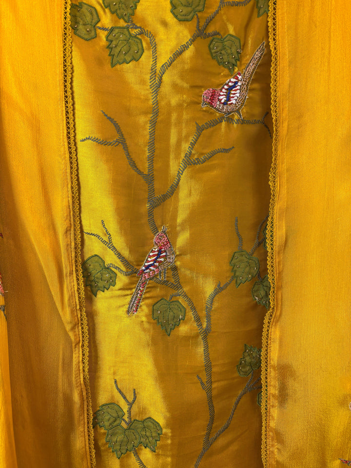 Design by Pakiza mustard yellow silk fabric with intricate bird appliqué, dabka embroidery, and delicate beadwork.