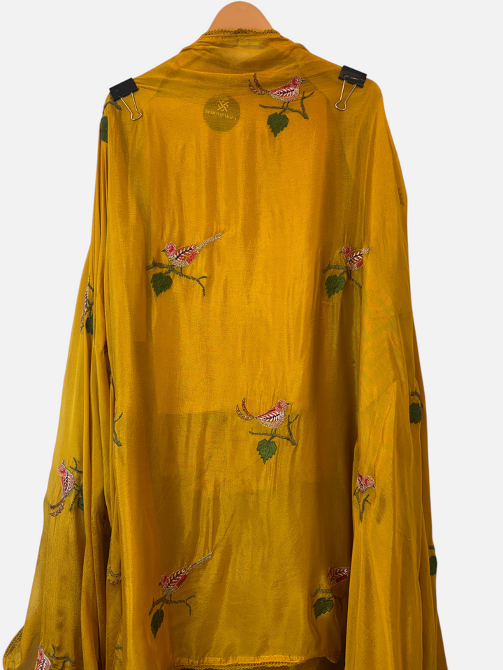 Design by Pakiza mustard yellow silk fabric with intricate bird appliqué and dabka embroidery for a 3-piece suit set