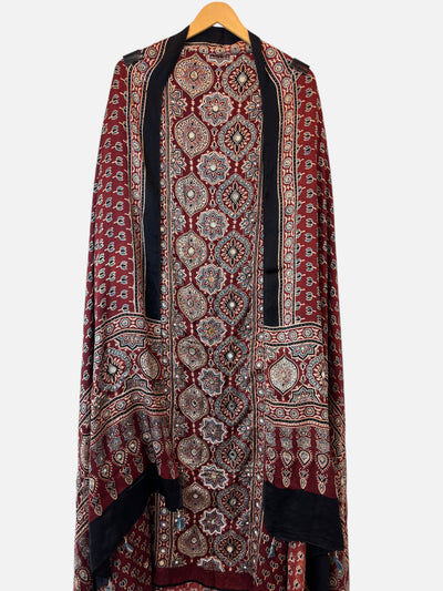 Design by Pakiza deep wine red Ajrakh modal shirt with intricate lotus block prints and cutdana embellishments.